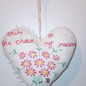 You're the cheese to my macaroni - a hanging heart with a whimsical 'love note'
